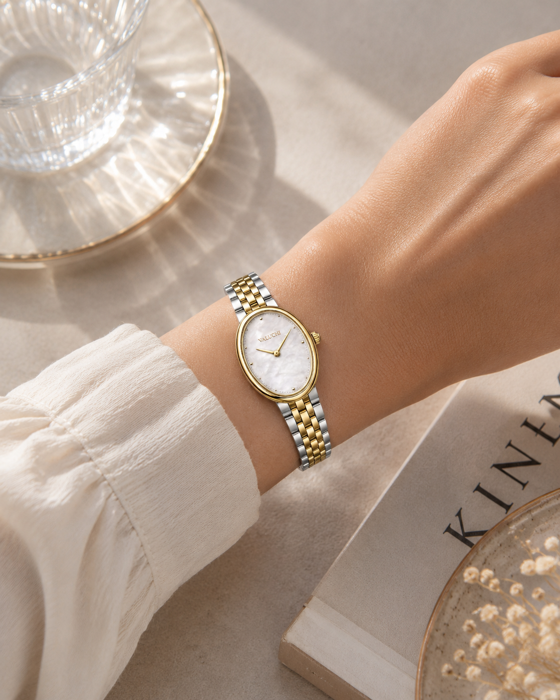 Valuchi two-tone oval women’s watch worn on the wrist