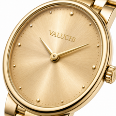 Gold-tone stainless steel watch with a round bezel, matching gold-tone dial, hands, hour markers, and link bracelet. The brand name 'VALUCHI' is printed on the dial.