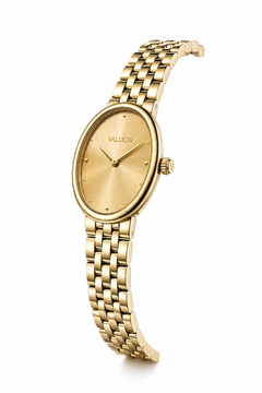 A gold-tone oval wristwatch with a matching metal link bracelet, featuring a textured gold dial, small dot hour markers, and the brand name 'VALUCHI' printed above the 12 o'clock position.